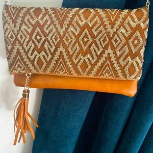 No brand - brown folding bag with a gold chain & fringe tassel. Gold mesh.